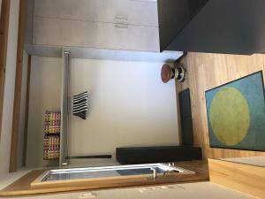 a view of a kitchen with a stove at Apartment Lischenhaus 2 - Wohnung Flösch by Interhome in Lenk