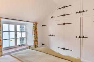 a bedroom with white cabinets and a window at 1 Bed in Wells oc-h30450 in Wells