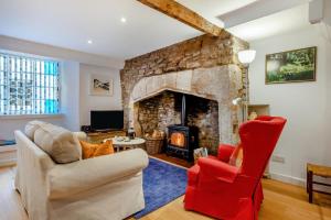 a living room with a couch and a fireplace at 1 Bed in Wells oc-h30450 in Wells