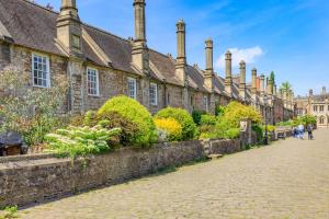 a cobblestone street in front of an old building at 1 Bed in Wells oc-h30450 in Wells