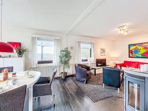 a living room with a table and chairs at Apartment Martin by Interhome in Frankenau