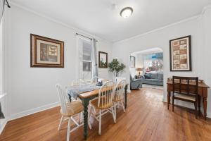 a dining room with a table and chairs at 3BR Home Across from Como Lake - Aspen in Saint Paul