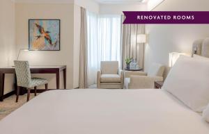 a hotel room with a bed and a desk at Crowne Plaza Porto by IHG in Porto