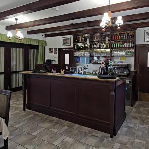 a bar in a restaurant with a large counter at Esterházy Fogadó in Gánt +46 photos