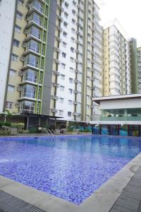 a large swimming pool in front of some buildings at The Storeys - Mesaverte Residences CDO in Pontud