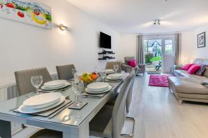 a dining room and living room with a table and chairs at 3 Bed in St. Ives oc-c30315 in Carbis Bay