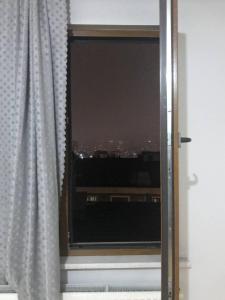 a window with a view of a city at Nefes Evleri in Istanbul