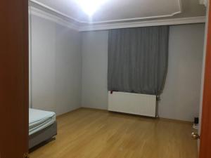 a small room with a bed and a window at Nefes Evleri in Istanbul