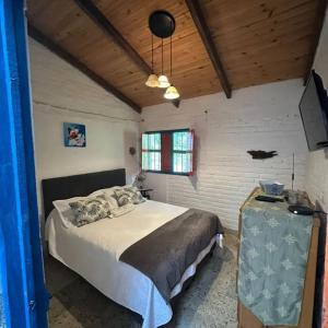 a bedroom with a large bed and a window at Ingenia Casa Hostal in Palmira +20 photos