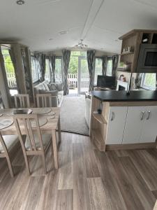 a kitchen and living room of an rv at Sunset retreat in Crowle