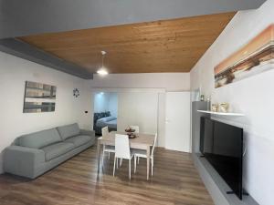 a living room with a couch and a table at Luma Sixty nine in Alcamo