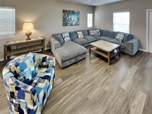 a living room with a couch and a table at Hammonds Reef in Padre Island
