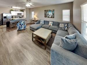 a living room with a couch and a table at Hammonds Reef in Padre Island