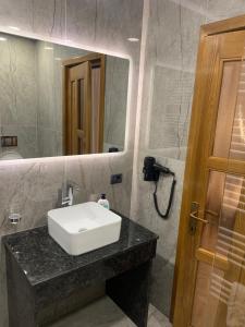 a bathroom with a white sink and a mirror at Vila Mery in Moisei +58 photos