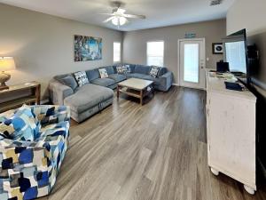 a living room with a couch and a table at Hammonds Reef in Padre Island