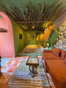 a living room with a couch and a table at Casa Amina in Chefchaouen