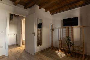 a living room with a flat screen tv on the wall at La casina de la alberca in La Alberca