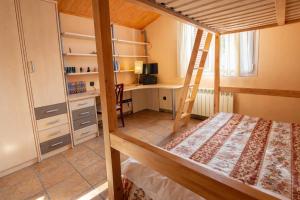 a bedroom with a bunk bed and a desk at Catalunya Casas Peaceful Perfection , only 30km from Barcelona! in Vacarisas +41 photos