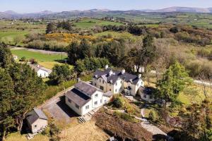 an aerial view of a large white house at Bay View Ridge Cottage in Bantry