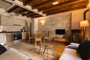 a living room with a couch and a table at La casina de la alberca in La Alberca