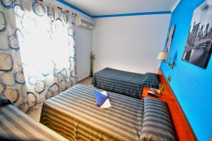 Posteľ alebo postele v izbe v ubytovaní Hostal Apolo Trece