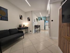 a living room with a couch and a table at Estudios Céntricos 65 in Santander