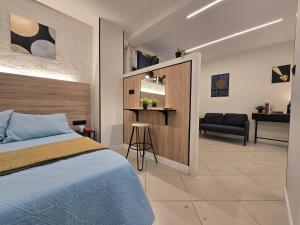 a bedroom with a bed and a chair in a room at Estudios Céntricos 65 in Santander