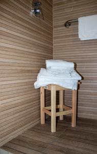 a table with towels on it in a bathroom at Augustea Travel Rooms in Frignano +55 photos