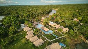 an aerial view of a resort with a river and trees at Irapay Amazon Lodge in Padre Cocha