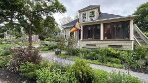 a house with a garden in front of it at Forest City Oasis and Spa in South Portland