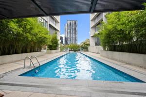 a swimming pool in the middle of a building at Balcony Apt with 1 Bedroom in Belconnen