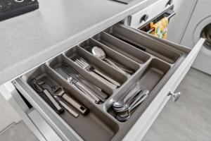 a drawer in a kitchen with utensils in it at Troon Golf by the Sea in Troon +23 photos