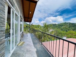 a balcony with a view of the mountains at Mulberry villa in Kandy