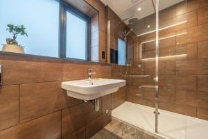 a bathroom with a sink and a shower at Elder howe in Penrith +15 photos