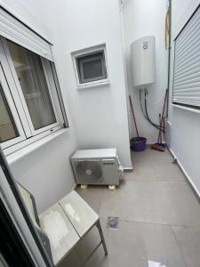 a small room with a heater and a window at Mare Studio by All Around in Heraklio +31 photos
