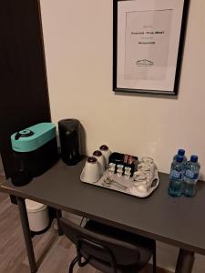 a table with a tray of water bottles on it at Saint Annes Guest House - 22 Berkeley in Dublin