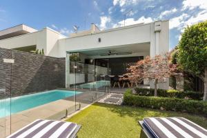 an external view of a house with a swimming pool at The Pool Pavilion - Where City meets Beach in Melbourne