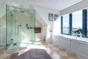 a bathroom with a glass shower and a sink at 5 Bed in Walberswick oc-lev in Walberswick +21 photos