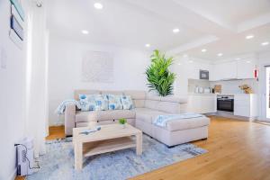 a living room with a couch and a coffee table at GuestReady - Sea Escape Azores in Lagoa