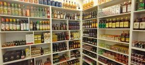 a store filled with lots of bottles of alcohol at Sukra Residency in Valavanūr