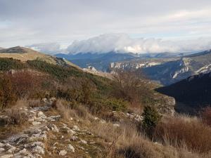 a view of a mountain range with clouds in the background at Logis du Grand Puits in Baudinard +21 photos