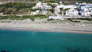 an aerial view of a beach with white buildings at Ocra Fronte Mare in Torre Mozza +6 photos