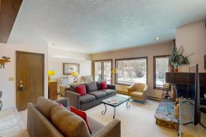 a living room with a couch and a table at Teton Shadows Darwin F in Jackson