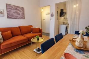 a living room with a couch and a table at Mami's in Alexandroupoli
