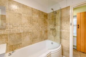 a bathroom with a bath tub and a shower at 2 Bed in Chatton oc-r27205 in Chatton +17 photos