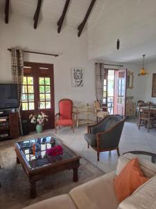 a living room with a couch and a coffee table at Chrysalide in Baillif