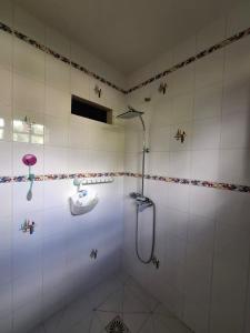 a bathroom with a shower and a sink at Chrysalide in Baillif +33 photos