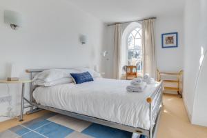 a bedroom with a bed and a table and a window at 2 Bed in Embleton oc-nb1960 in Embleton