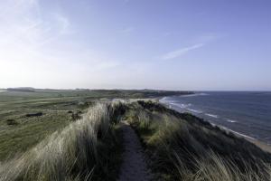 a view of a beach and the ocean at 2 Bed in Embleton oc-nb1960 in Embleton