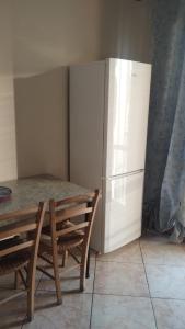 a kitchen with a table and a refrigerator at Colle Sul Mare in Termoli +20 photos